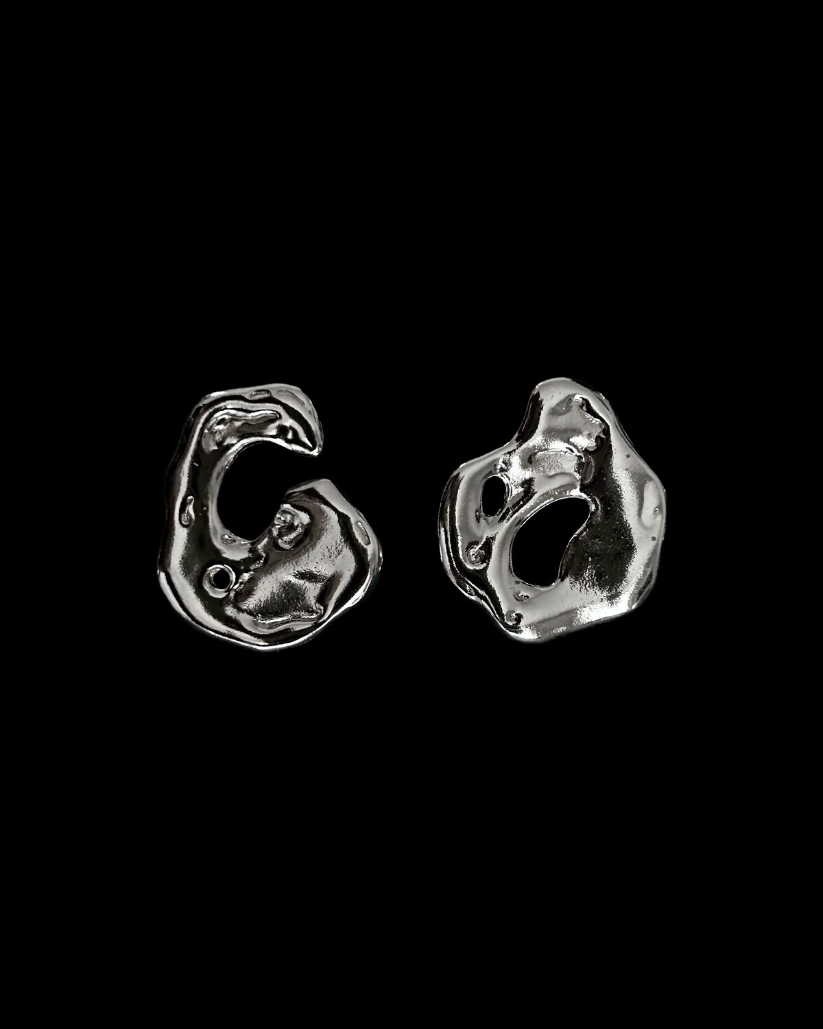 The Magma earrings, silver kept in the shape it took while cooling