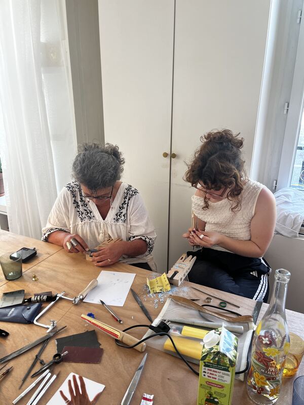Two participants carving side by side