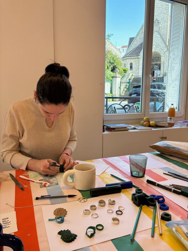 Carving a wax ring by the window