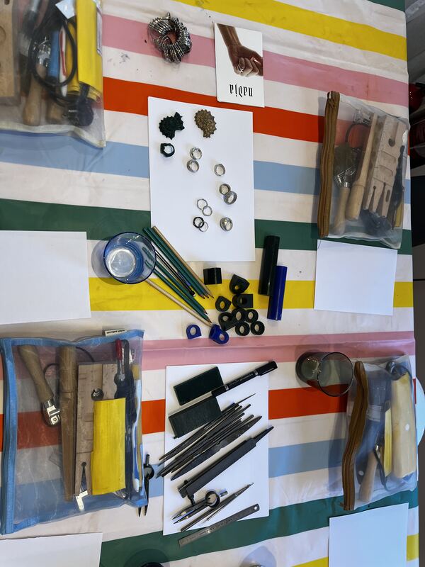 Wax, files and carving tools laid out for each place